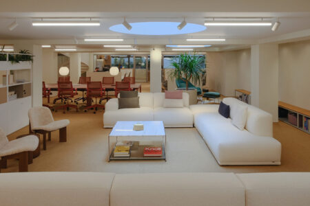 Modern office lounge with sofas and meeting area - Workplace Architecture Trends