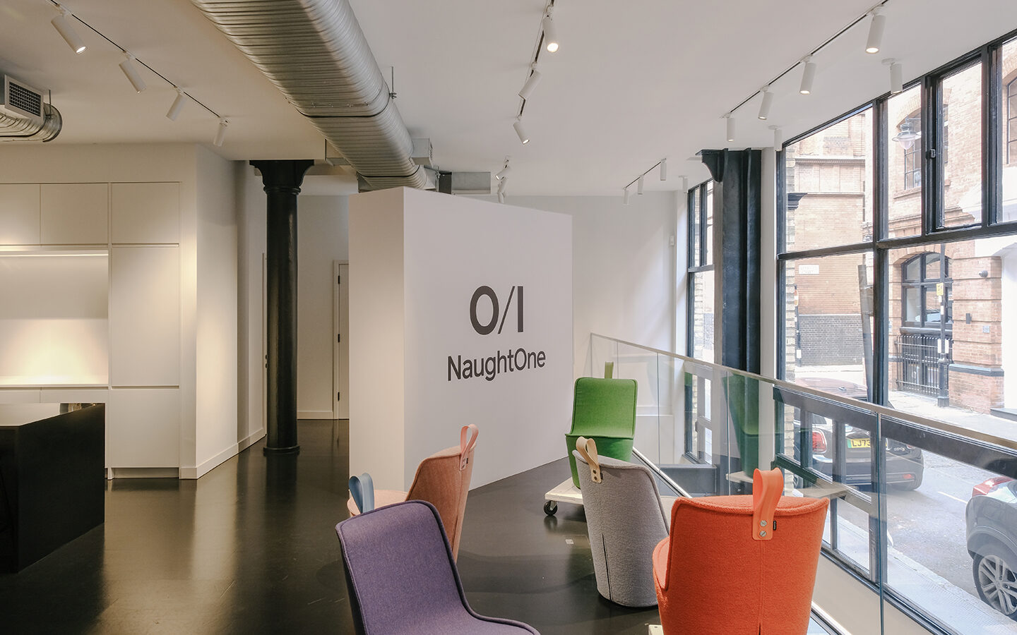 Modern office interior with colourful chairs.