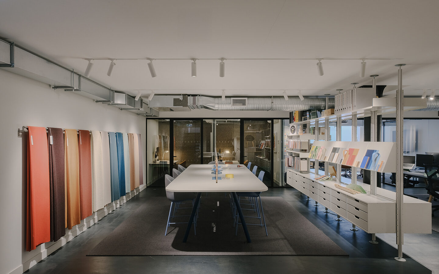 Modern office with colourful fabric samples displayed