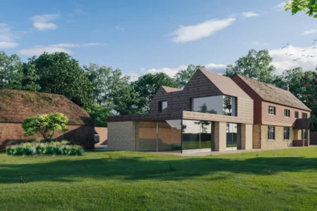 Modern brick house with large garden and trees.