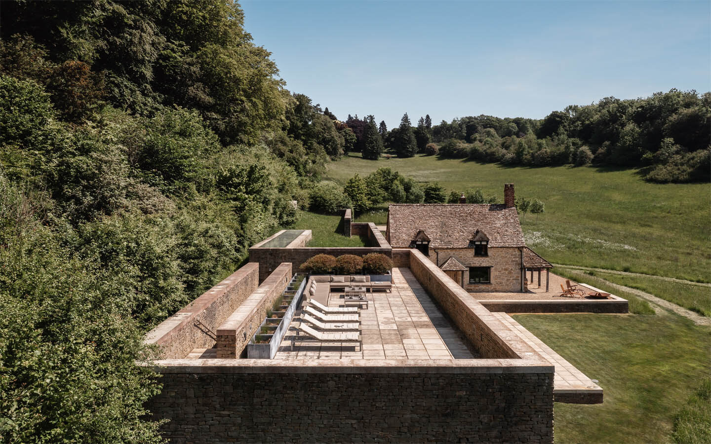 Rustic villa with patio and scenic countryside view.
