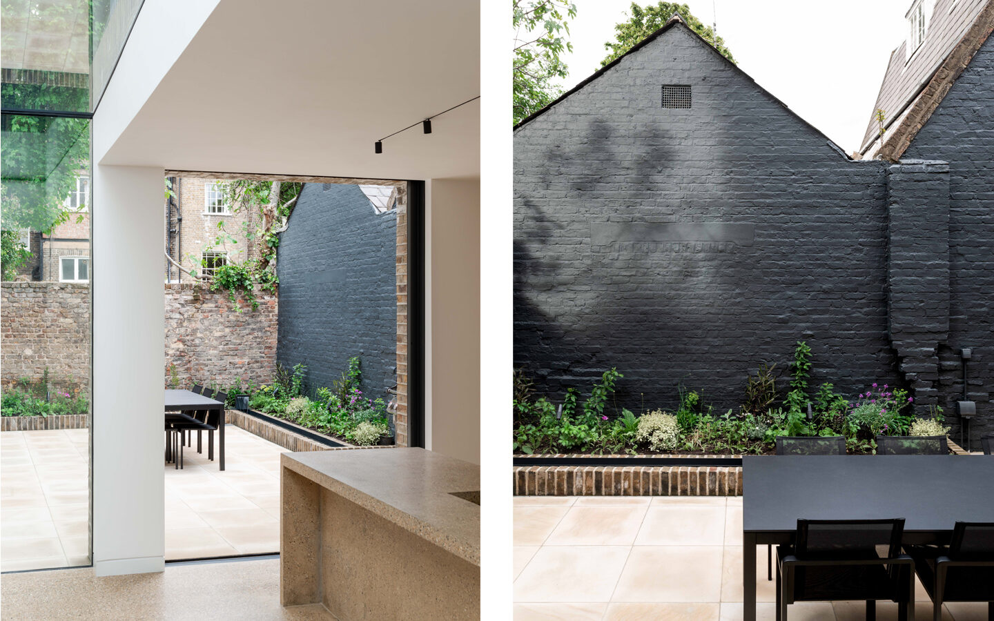 Modern garden view with patio and dark wall.