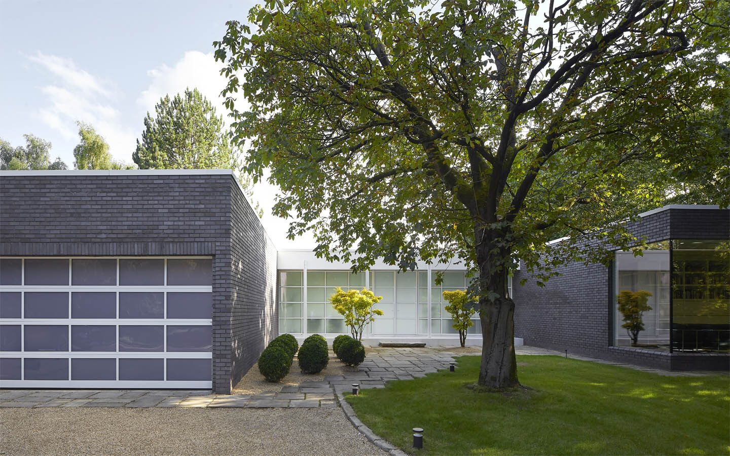 Modern house with glass and brick exterior view.