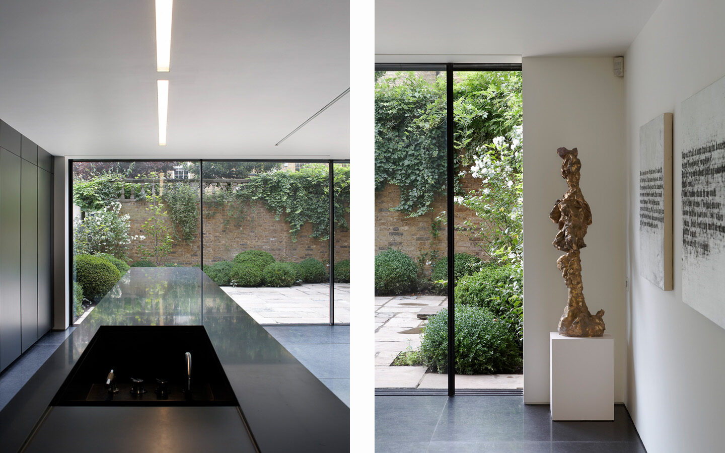 Modern interior with garden view through large windows.