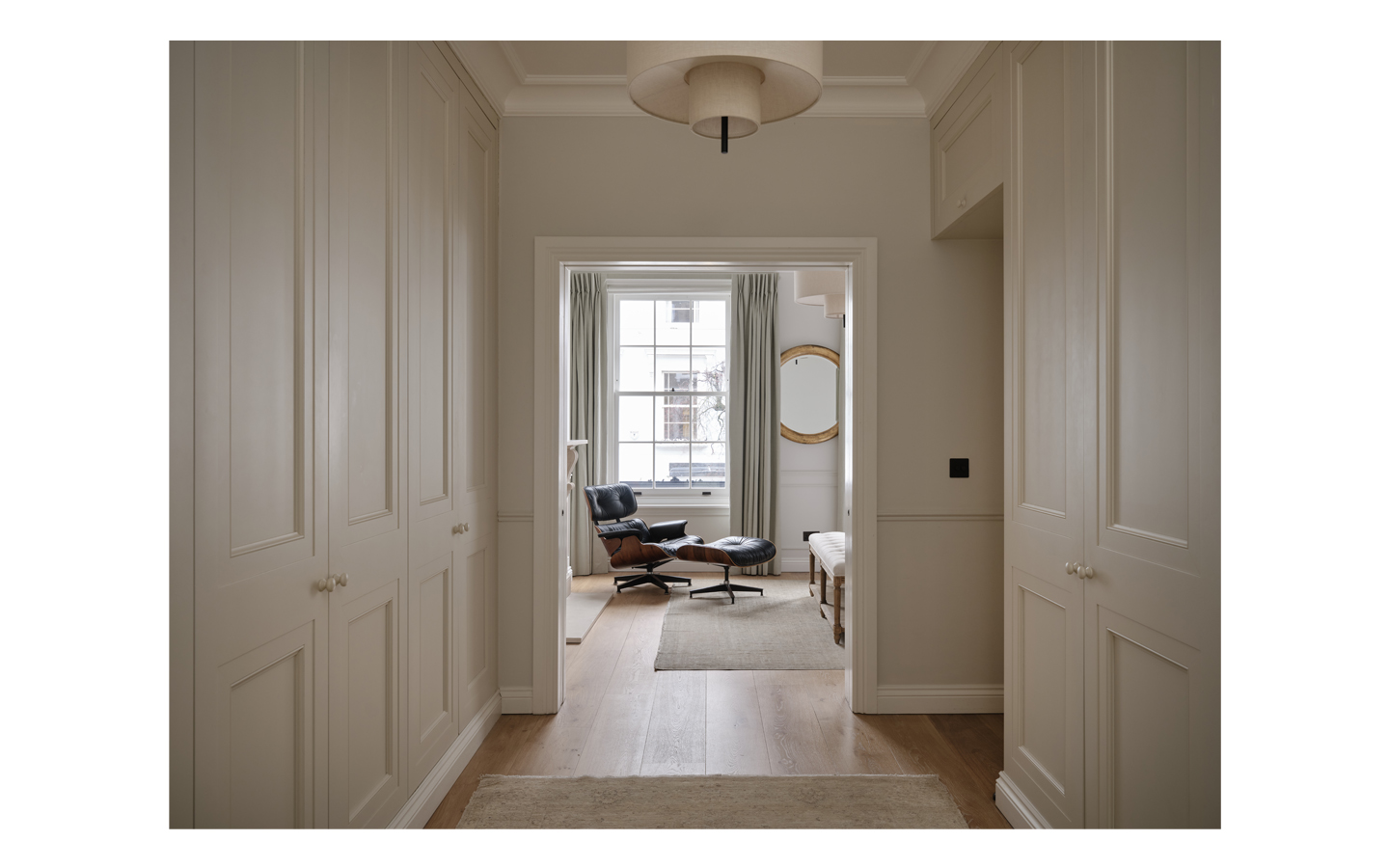 Elegant corridor leading to modern lounge area.