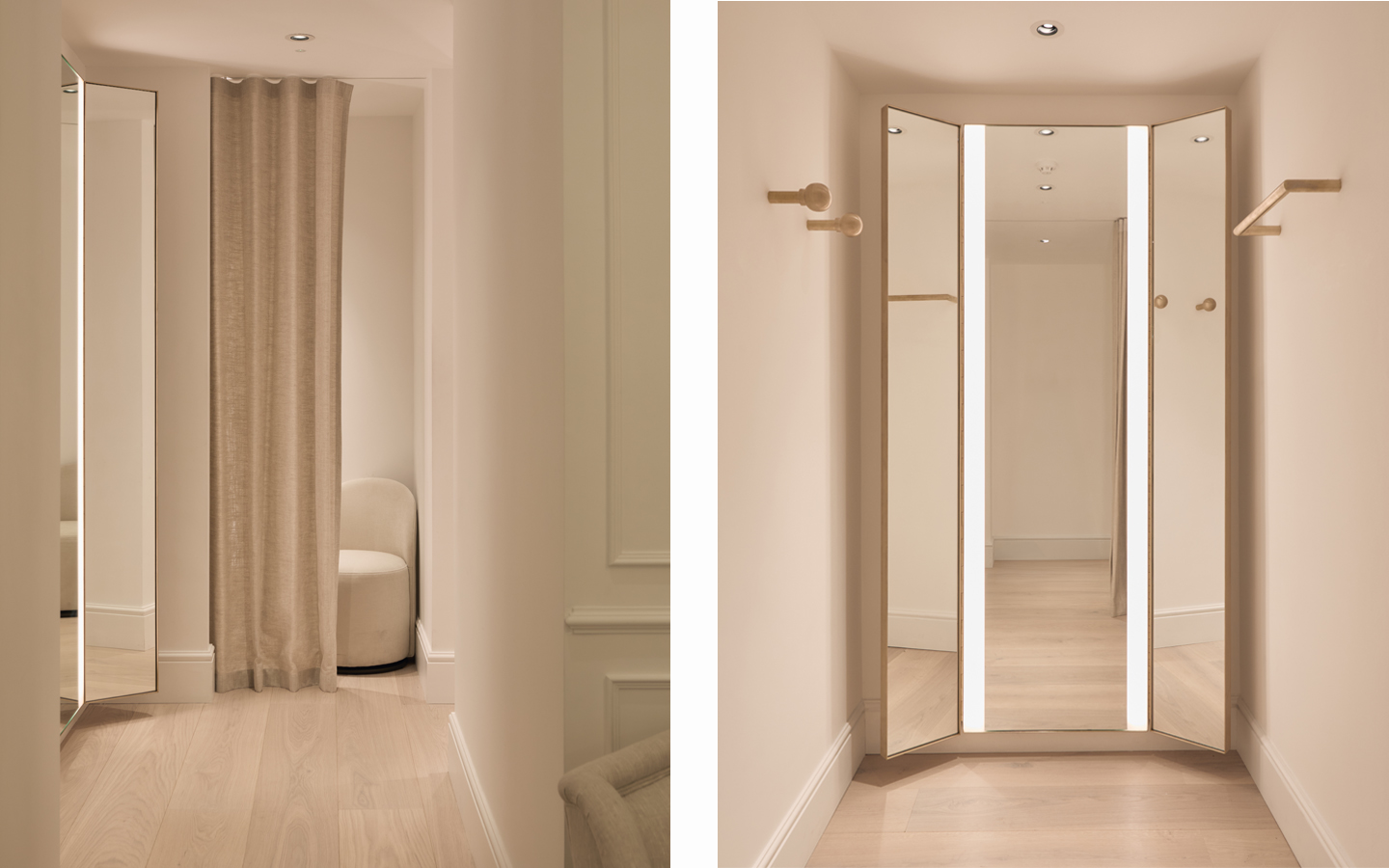 Modern fitting room with mirrors and beige curtain.