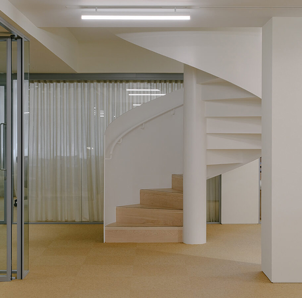 close up of minimalist architectural details, shadow gaps, textured plaster wall meeting a wooden floor, soft lighting