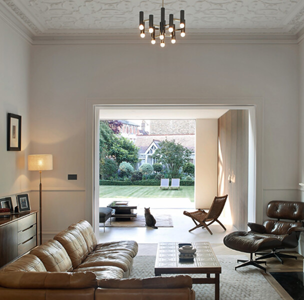 close up of minimalist architectural details, shadow gaps, textured plaster wall meeting a wooden floor, soft lighting