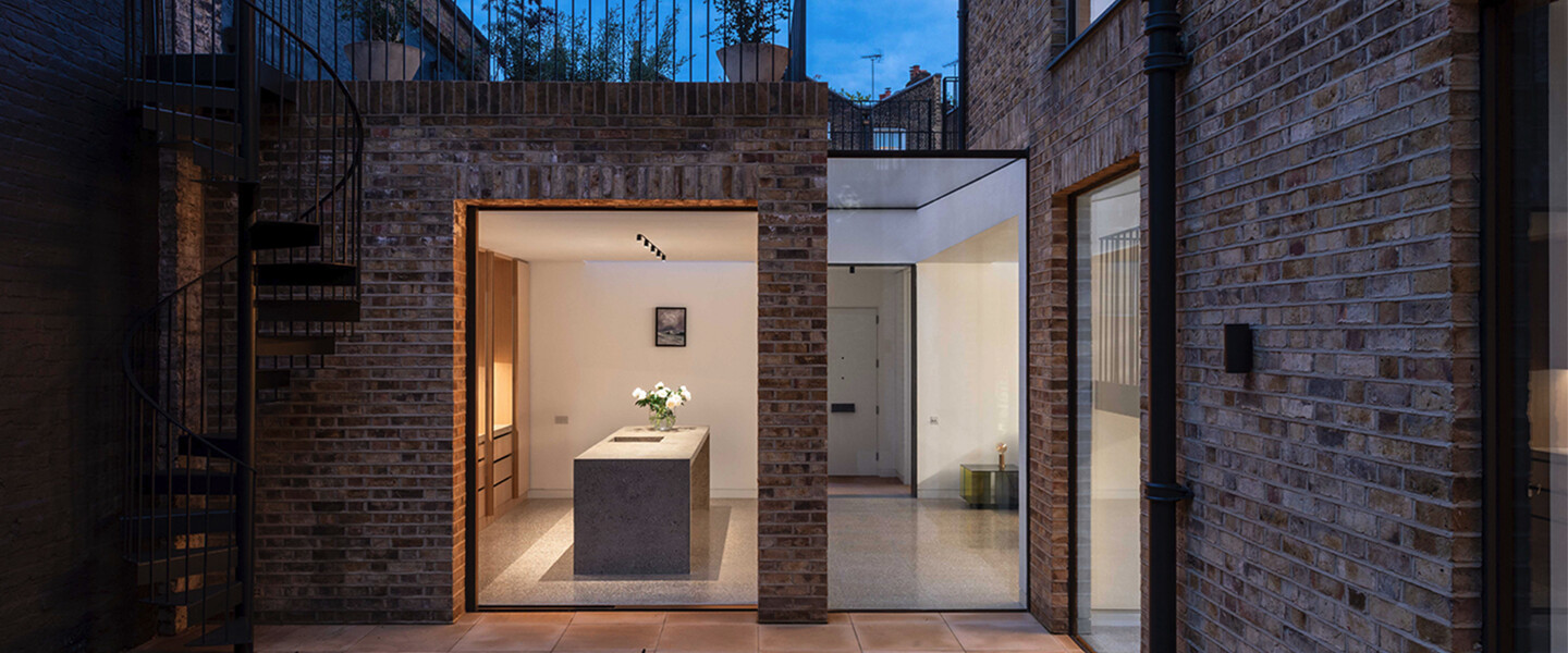 minimalist residential architecture, serene outdoor space, reflecting pool, concrete and glass structure, dusk lighting, architectural photography